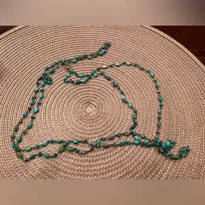 Turquoise bead wire strand with clasp.